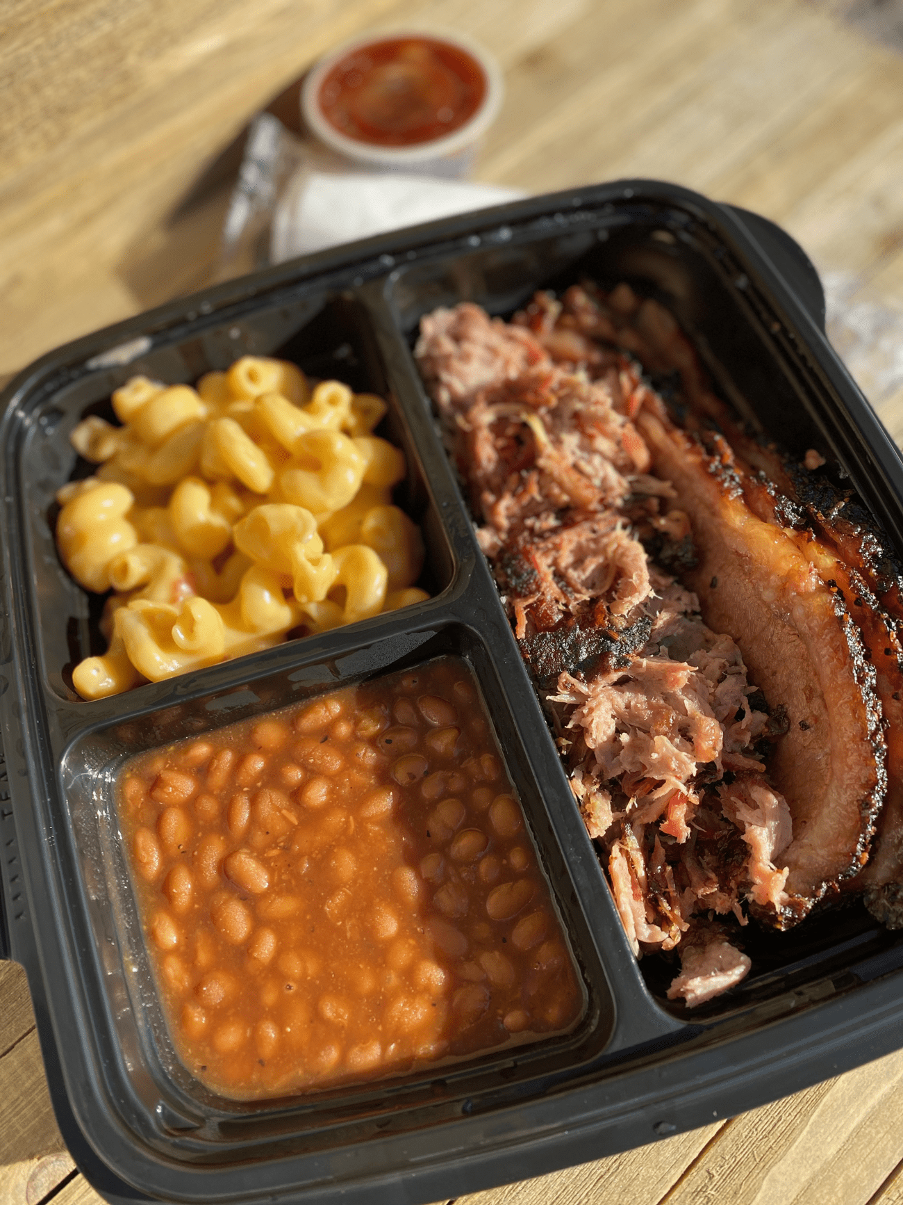 Individual Meal: two meat (brisket and pulled pork) with a side of mac and beans!