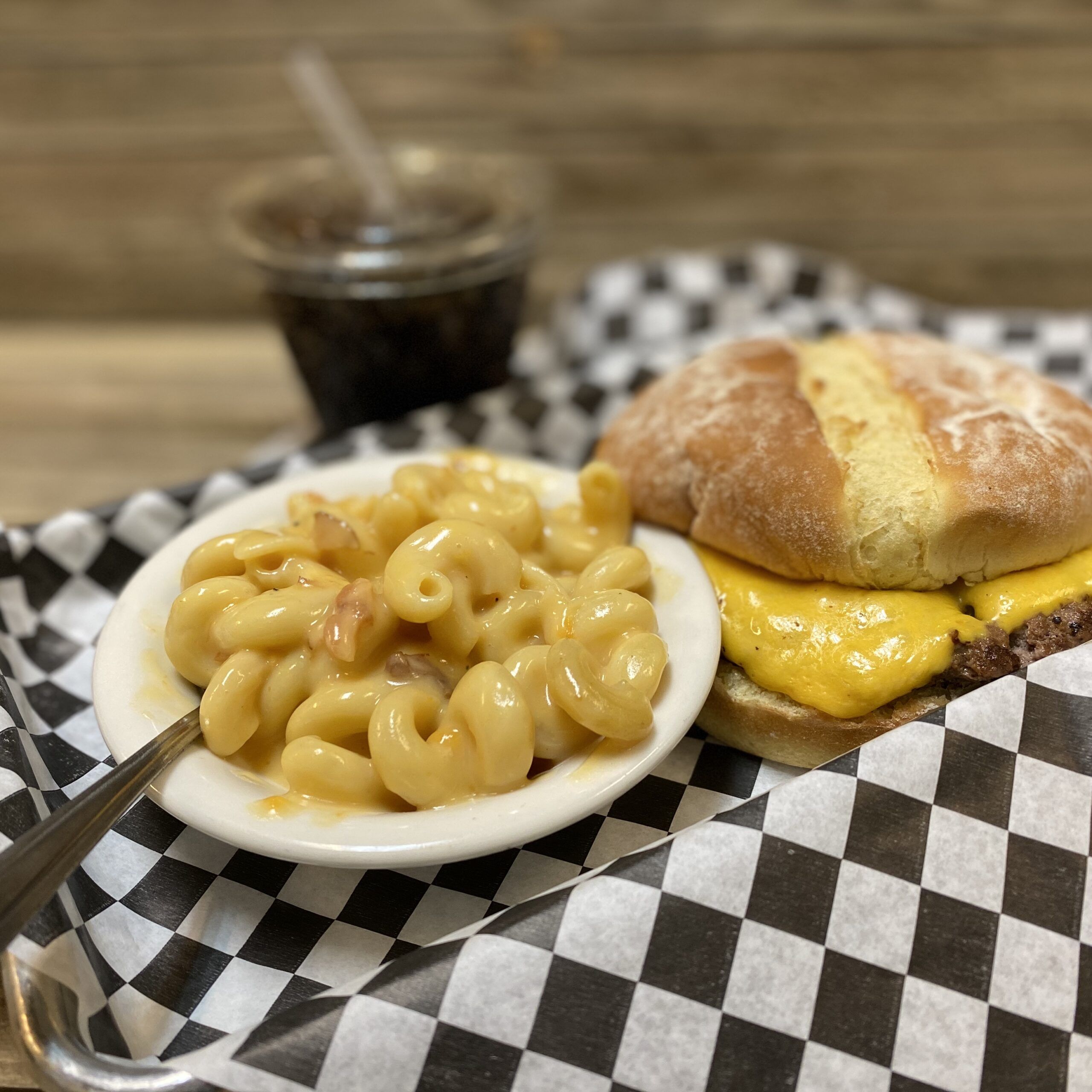 Kids burger served with a side of mac and cheese.