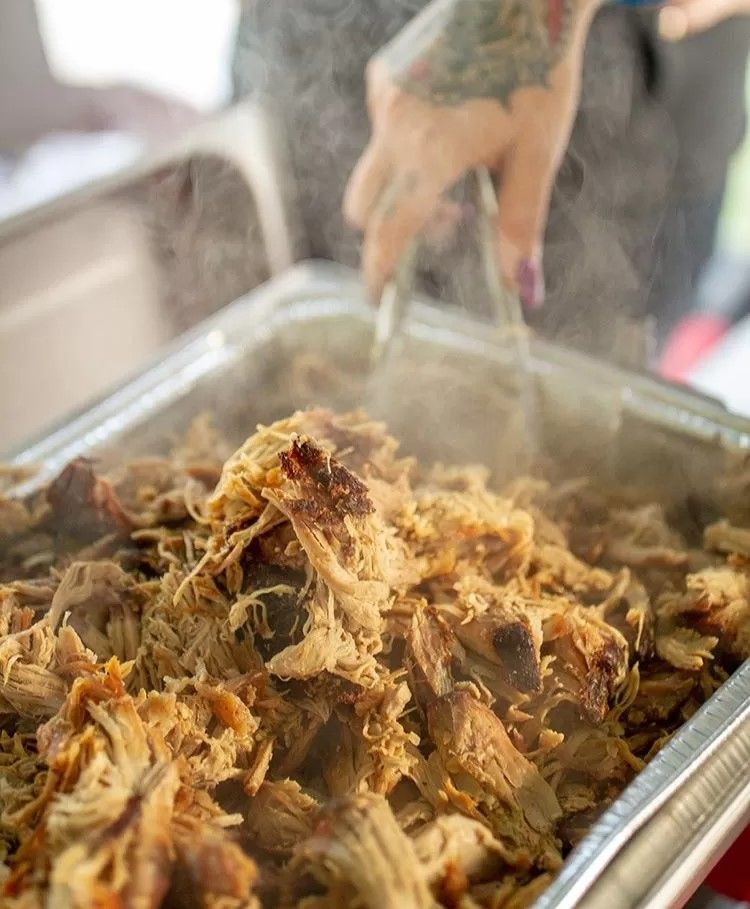 Smoked pulled pork in a catering chaffer.