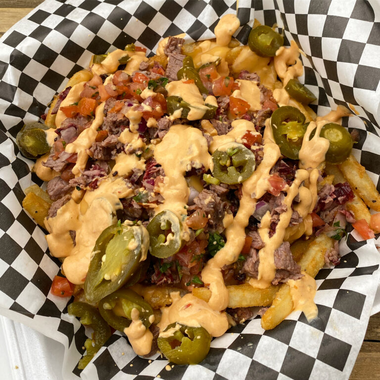 Fries with nacho cheese, pico, jalapenos, sour cream, sweet BBQ sauce with your choice of meat.