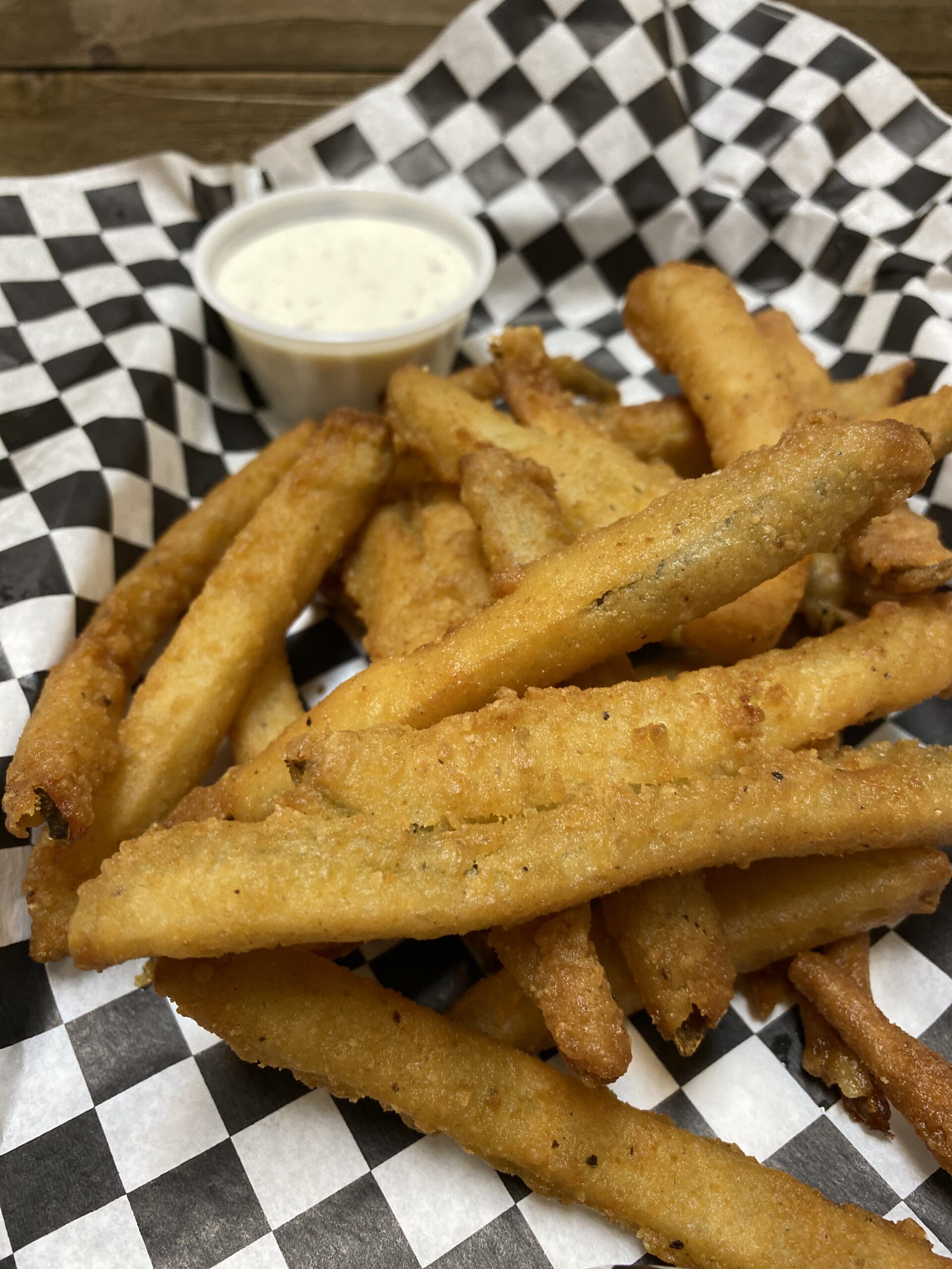 Pickle Fries. Fry-cut pickles dipped in spicy batter and deep fried. Served with house-made ranch.